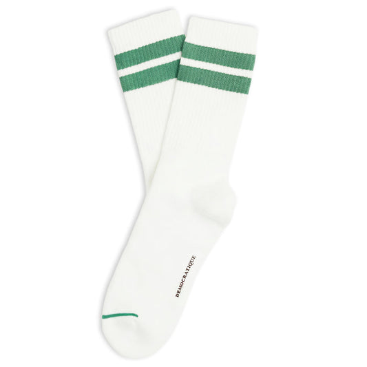 A pair of white crew socks with two green stripes near the cuff and a small green stripe on the toe, shown on a plain white background.