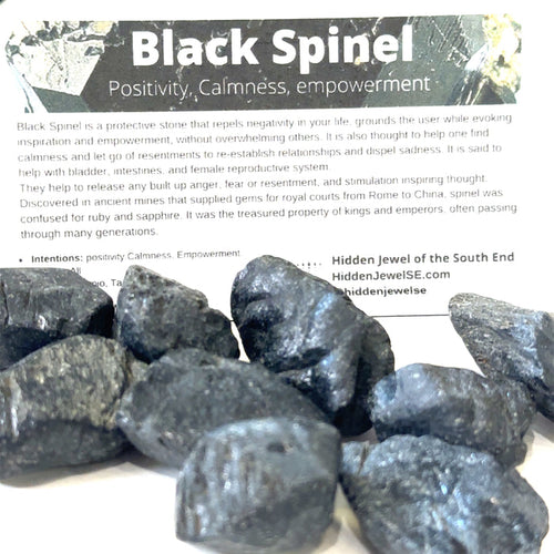 Black Spinel crystal with free information card included grouping on white front view
