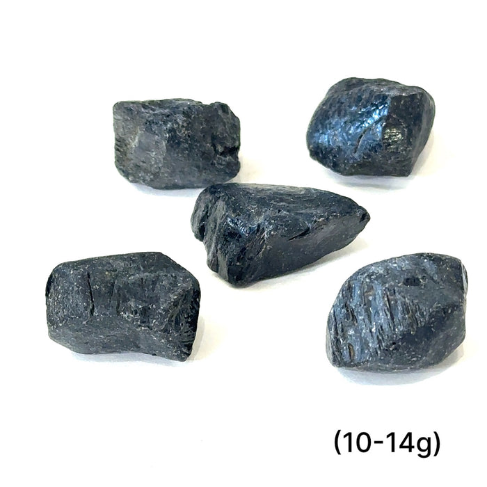 Ethically sourced raw Black Spinel gemstone with natural dark luster grouping (0-14g) on white overview