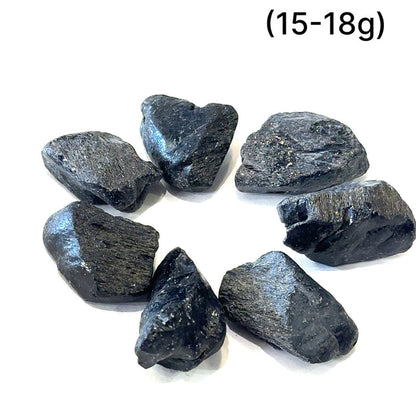 Healing Black Spinel crystal for positivity, calmness, and empowerment grouping (15-18g) on white overview