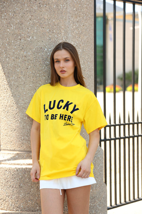 LUCKY TO BE HERE TEE - Love McNicoll