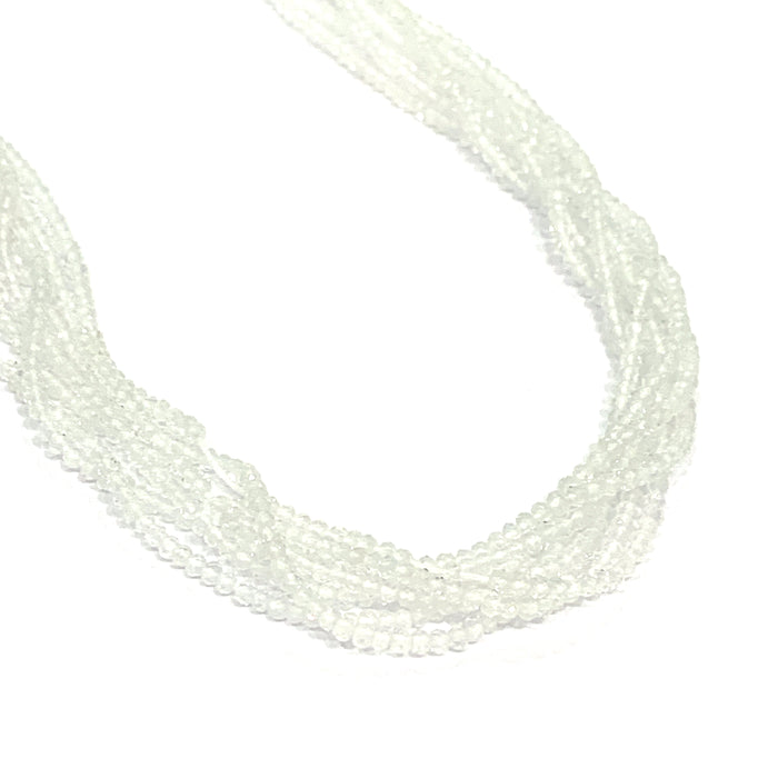 2mm Clear Topaz faceted round gemstone strand, on a white background, front overview.